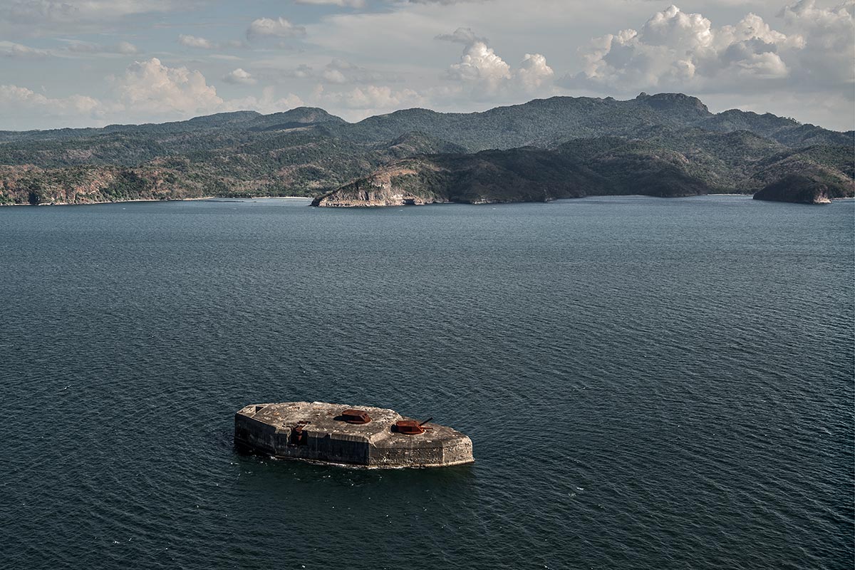 concrete battleship, rip #71, philippines, 2014 (built in 1909 by the USA it was catured by Japan in 1942 before the USA recaptured it in 1945 by pouring gasoline and igniting it)