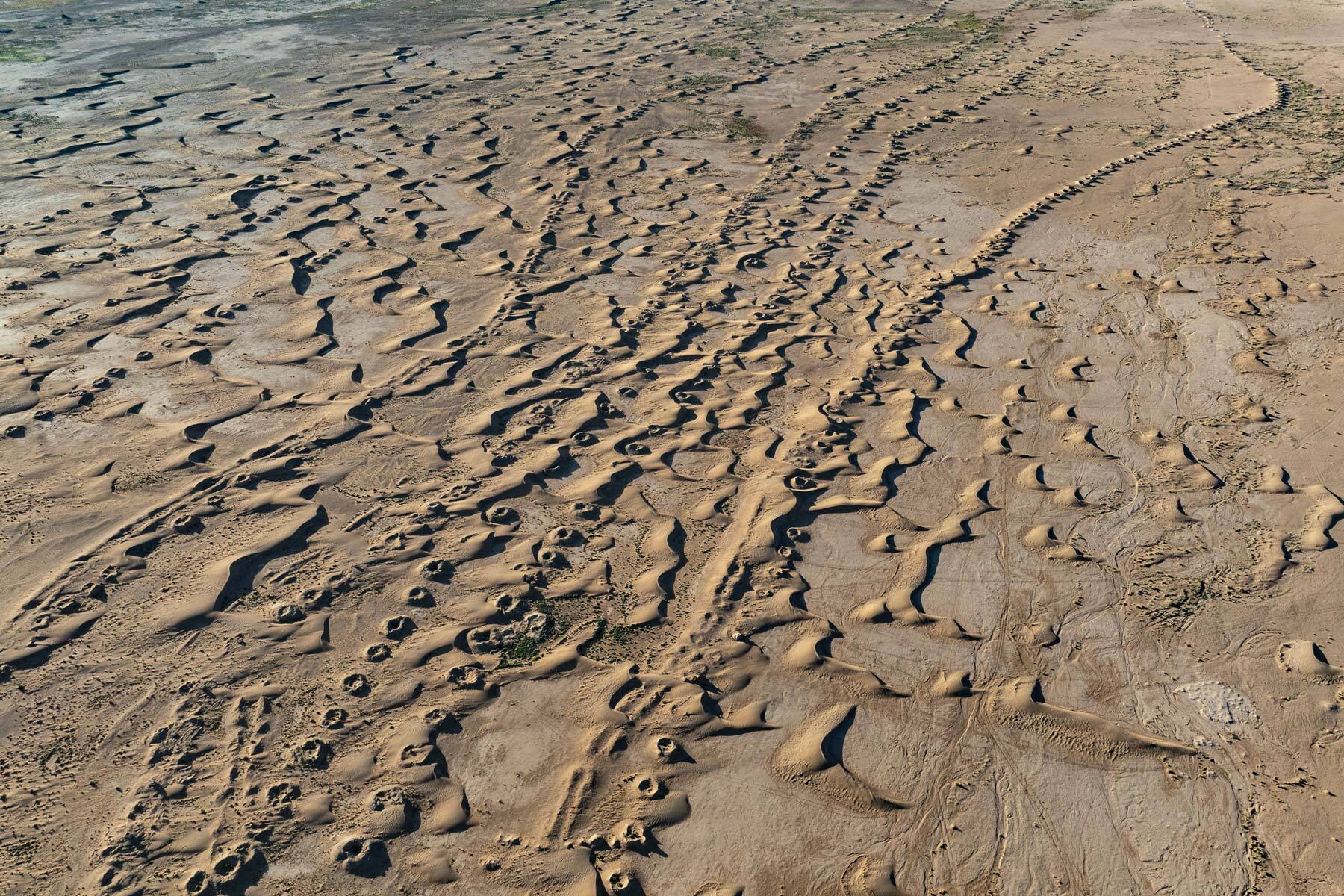 leftscape #46, morocco, 2025 (250y old foggaras dug by slaves - an underground water system with vertical shafts, connected by a gently sloping tunnel which carries water to a lower oasis. left cuz motor pumps)